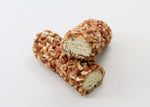 Two log-shaped pecan rolls against a white background.
