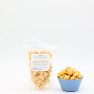 2oz bag and bowl of popcorn with 'Goodson' label on a white background
