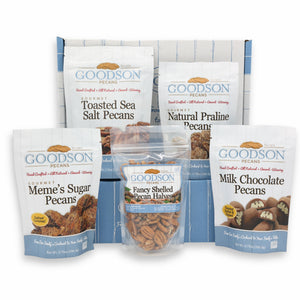 Assorted Goodson Pecans packages in front of branded box on a white background