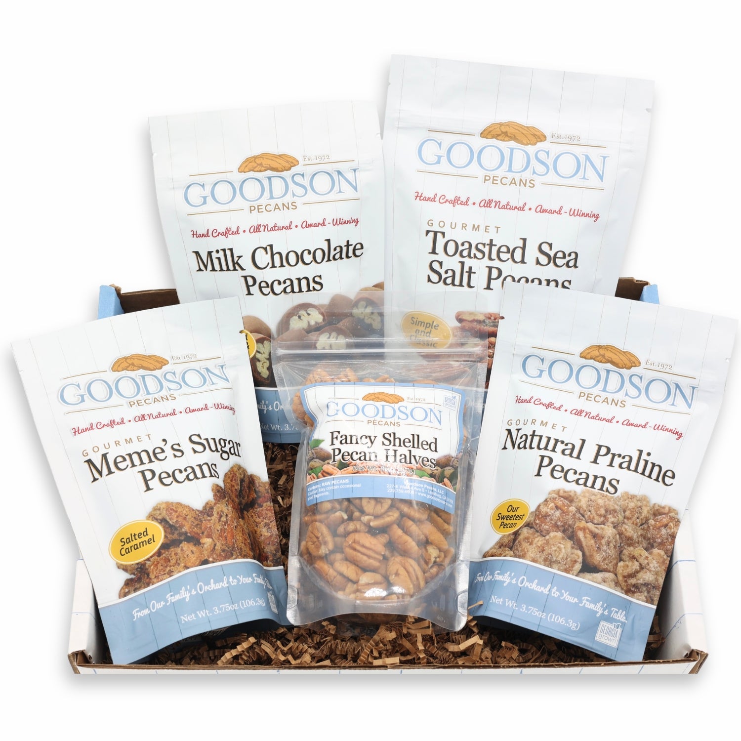 Assorted Goodson Pecans packages in a box on a white background