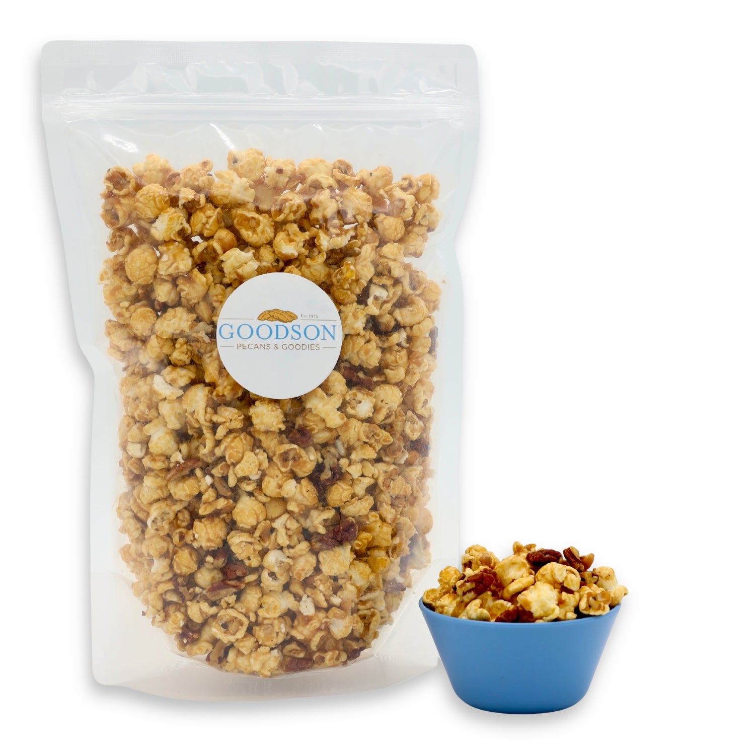 14oz bag of Goodson popcorn with a small bowl of popcorn next to it on a white background