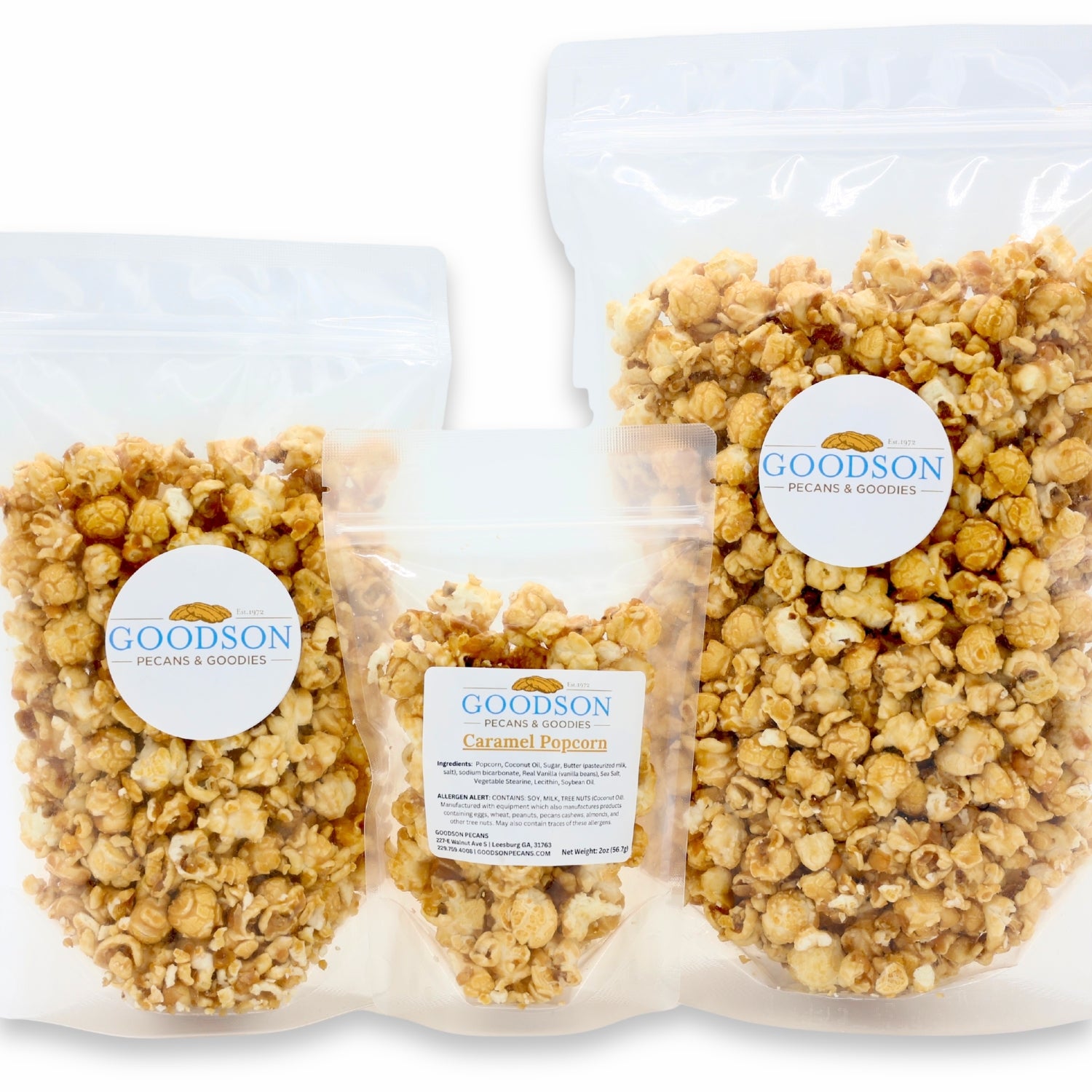 Three bags of varying sizes of Goodson Caramel Popcorn on a white background