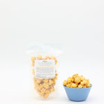 2oz bag and bowl of popcorn with 'Goodson' label on a white background