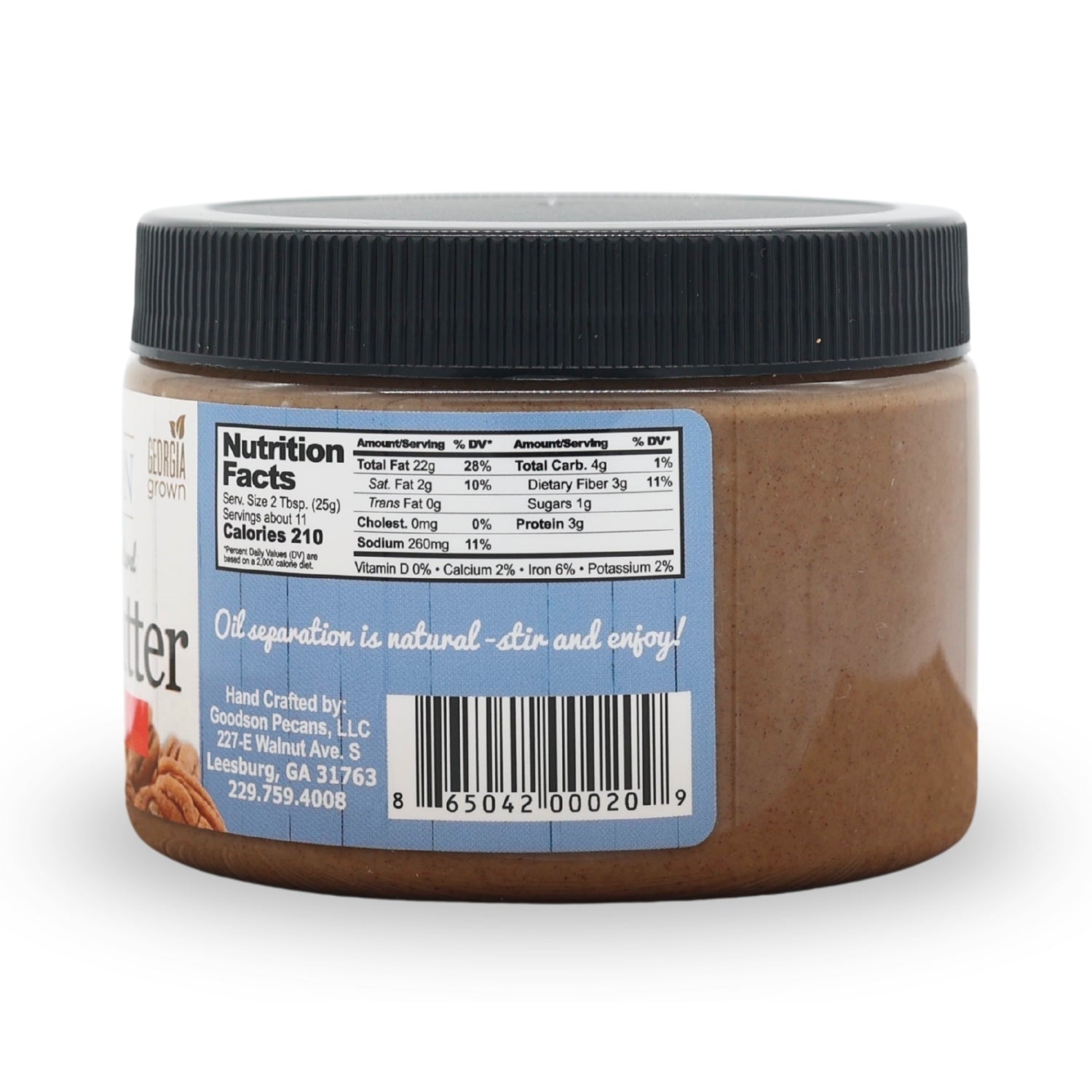 Jar of pecan butter with a label showing nutrition facts and product details on a white background.