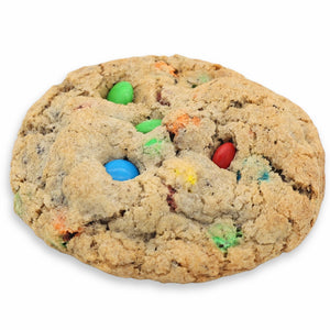 Cookie with colorful M&M candies on a white background