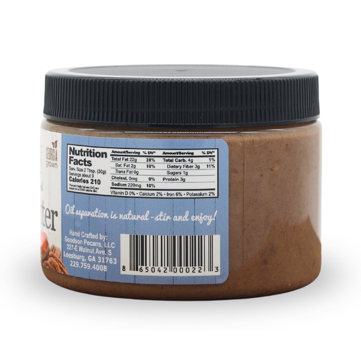 Jar of pecan butter with a label showing nutrition facts and other details on a white background