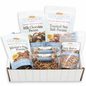 Assorted Goodson pecan packages in a white and blue striped box on a white background