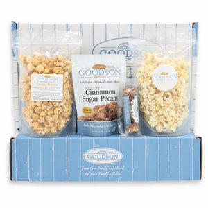 Goodson snack box with popcorn, pecans, and a pecan roll on a white background