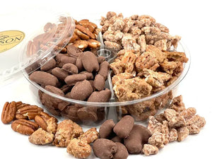 Assorted pecans in a clear plastic container on a white background.