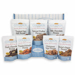 Packages of Goodson Pecans' Toasted Sea Salt Pecans, Natural Praline Pecans, Milk Chocolate Pecans, Dark Chocolate Pecans, Toasted Sriracha Pecans, Cinnamon Sugar Pecans, and Meme's Sugar Pecans with a Goodson Pecans Box against a white background.