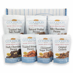 Assorted Goodson Pecans packages on a white background